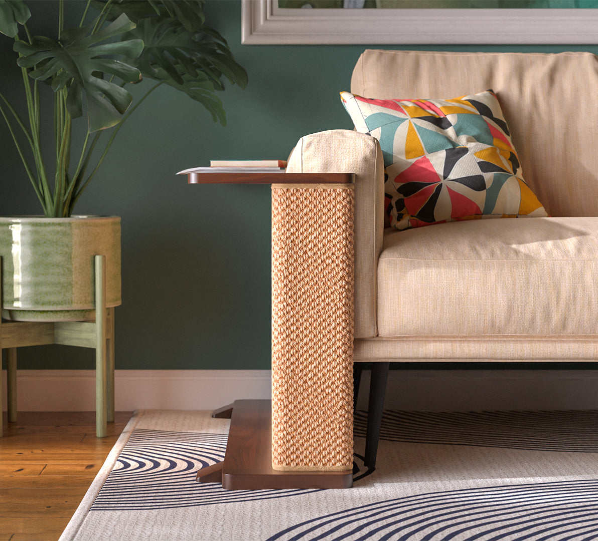 A Cat-e-Corner table placed next to a sofa, integrating a cat's scratching post with a small table, in a room with a plant and a colorful cushion.