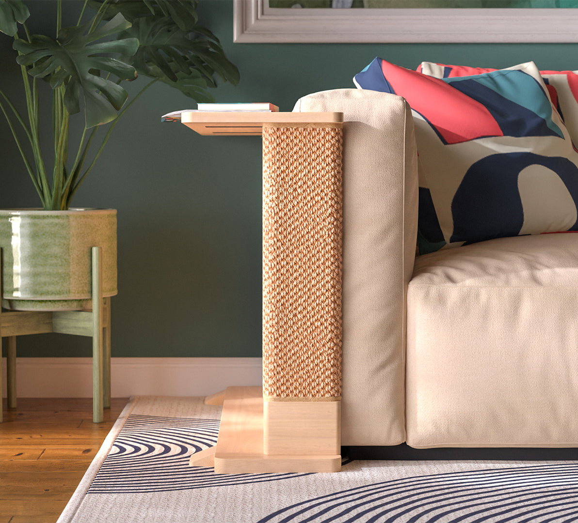 A Cat-e-Corner table placed next to a sofa, integrating a cat's scratching post with a small table, in a room with a plant and a colorful cushion.