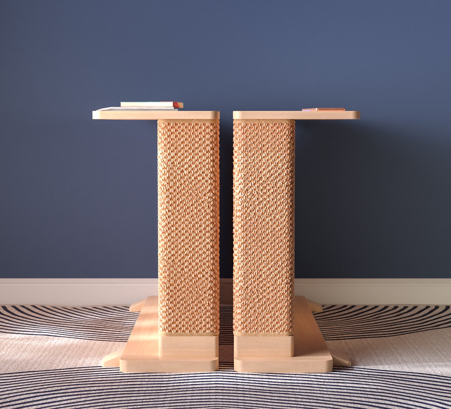 A Cat-e-Corner table placed next to a sofa, integrating a cat's scratching post with a small table, in a room with a plant and a colorful cushion.